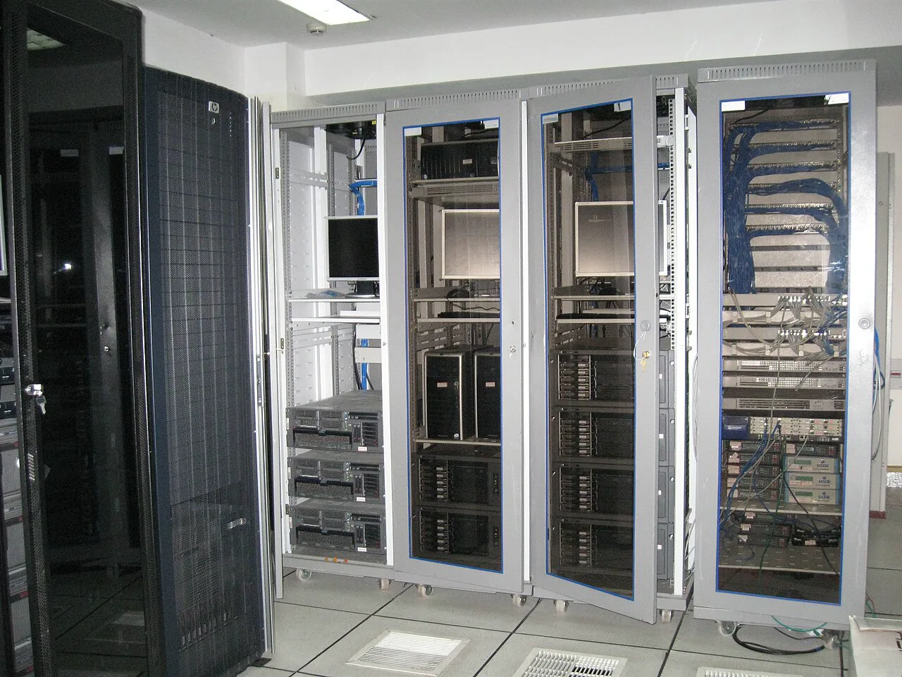 Open professional rack with multiple ASIC mining units in a modern data center