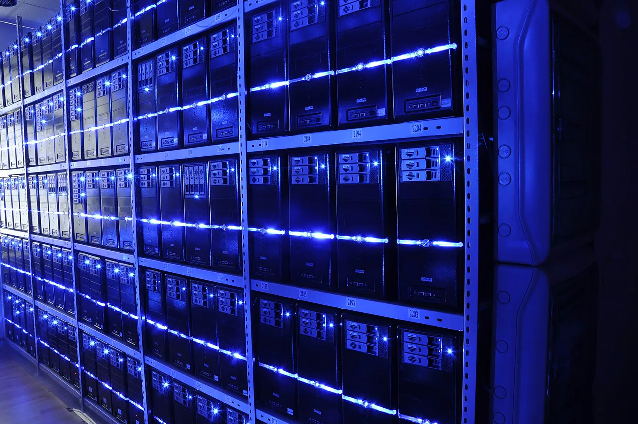 Large-scale Bitcoin mining farm zone with multiple illuminated server rows
